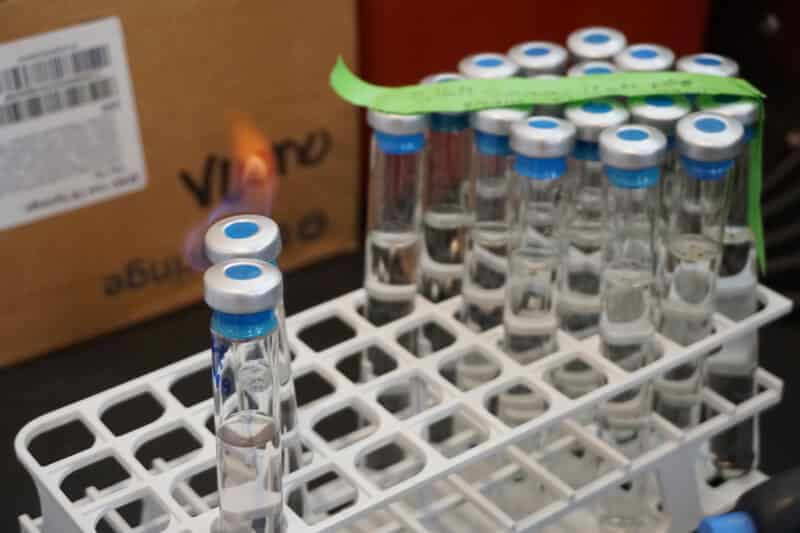 Sample bottles being flame sterilized.