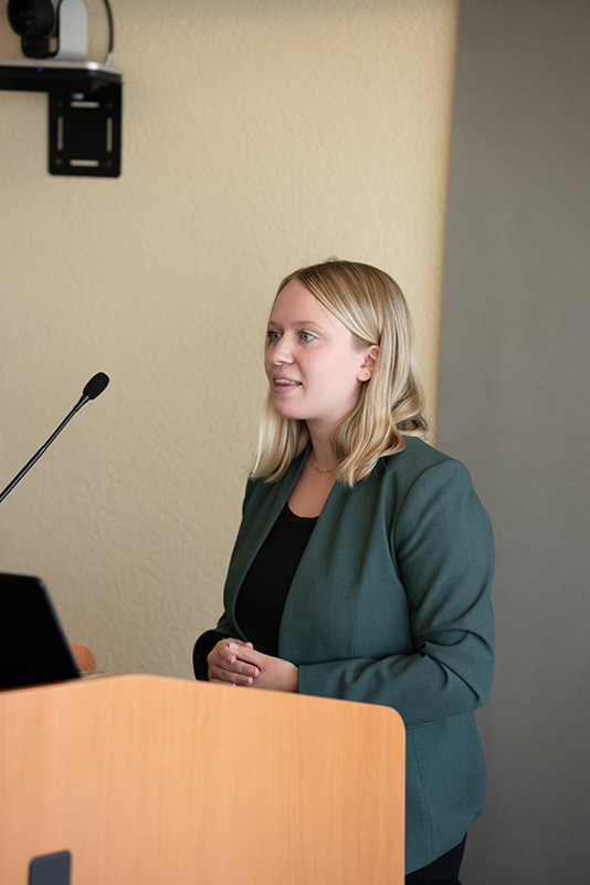 Photo of award winner Andrea Gordon at the podium.