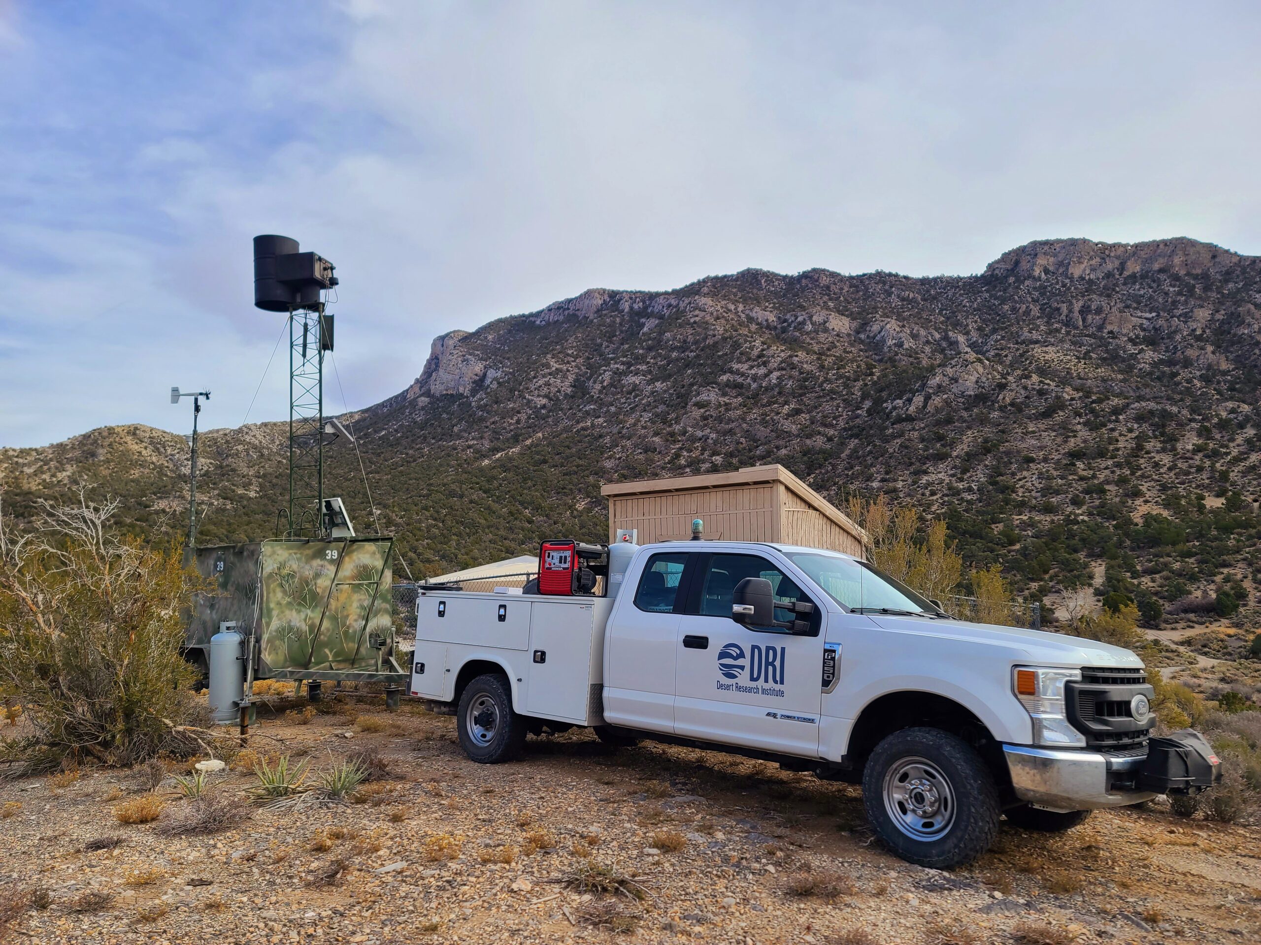 PIcture of Cloud Seeding station and DRI truck. 