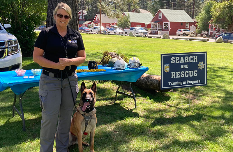 Cablk with her dog, Dax, at a search and rescue training course