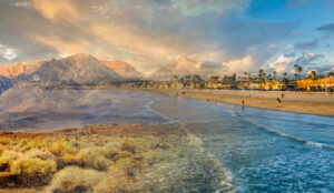 Image of the beach on the CA coast blending into the mountains.