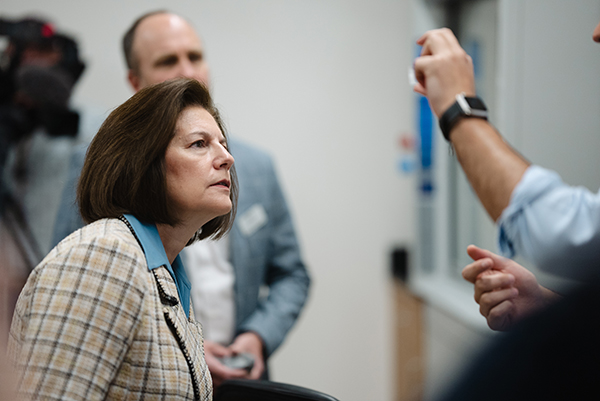 Senator Cortez Masto looking at research being conducted in the lab. 