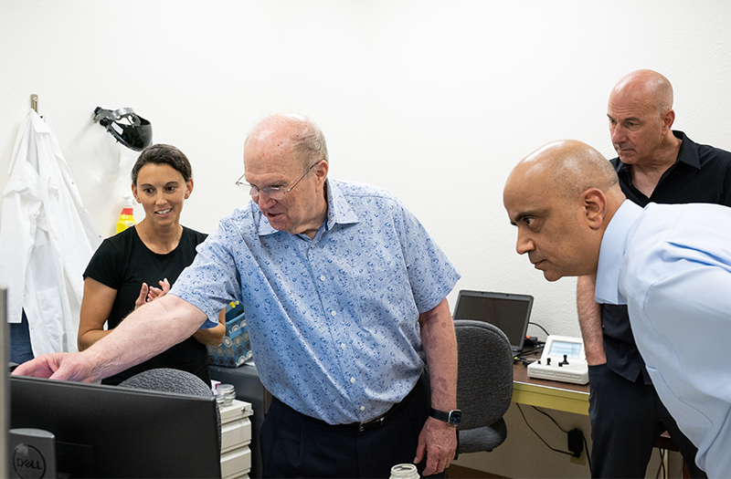 Robert Lewis pointing at a screen in a DRI Lab.